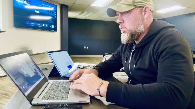 owner Jonathan Soucy working on computers